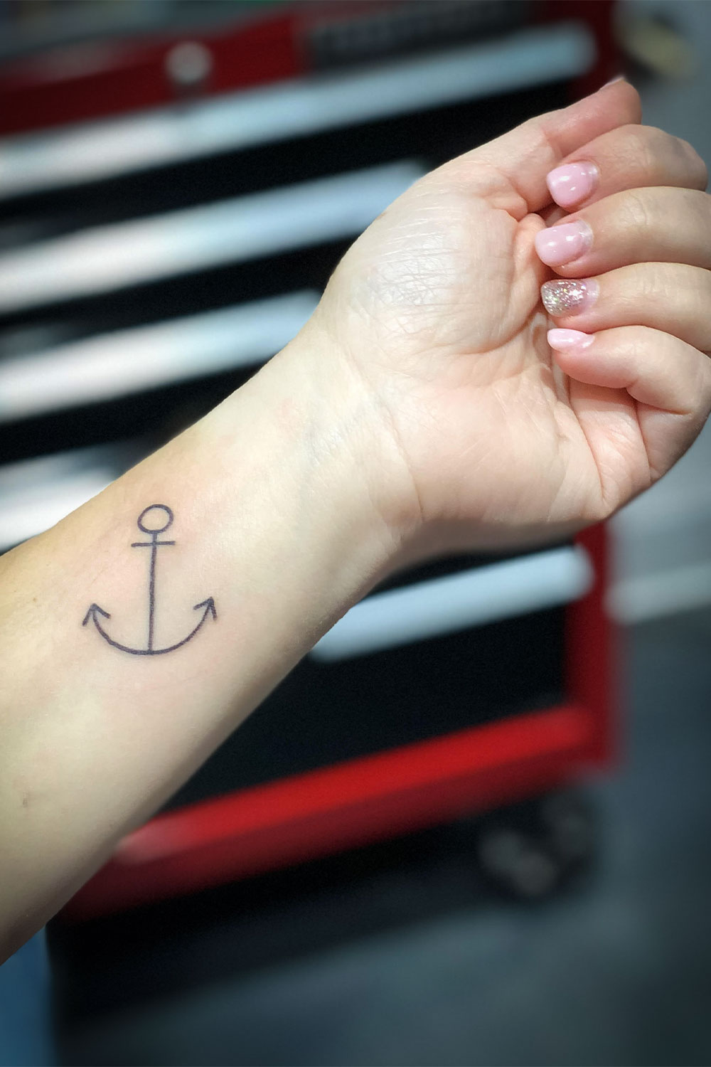 Star Hands and arm with anchor tattoo